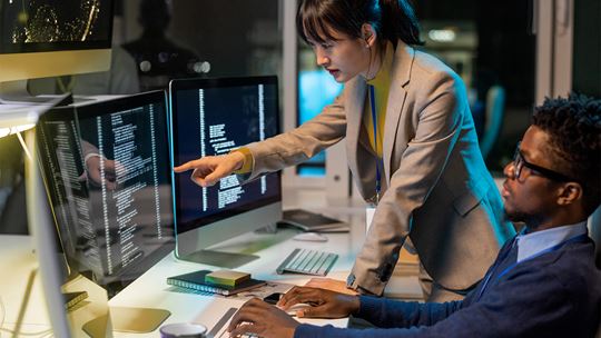 People working over a screen